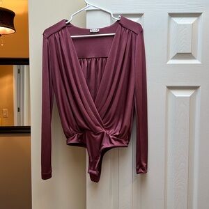 7/$20 
Intimately Free People Small Thong body suit w/crisscross front.